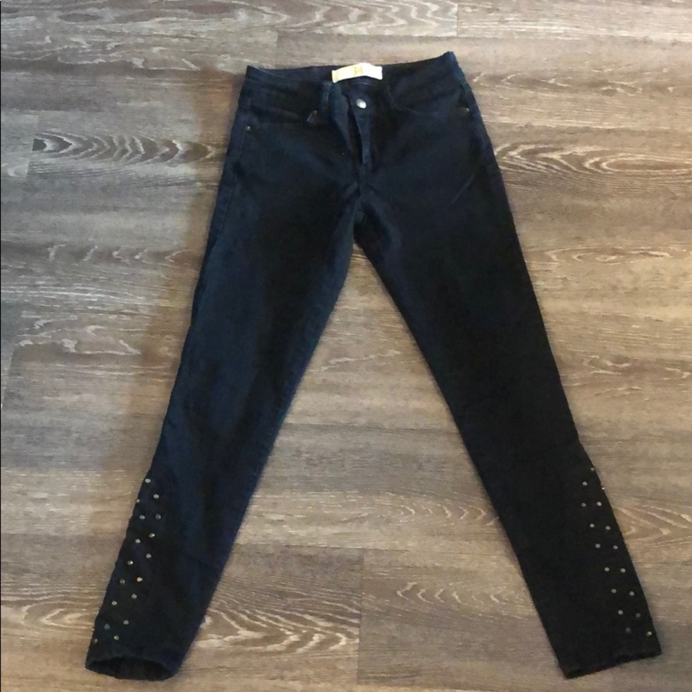 Black denim ankle jeans with stud details